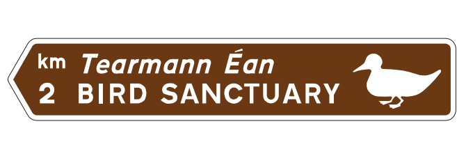 Tourist attraction direction sign Ireland brown